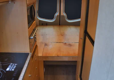 interior of Sprinter Van conversion showing bed