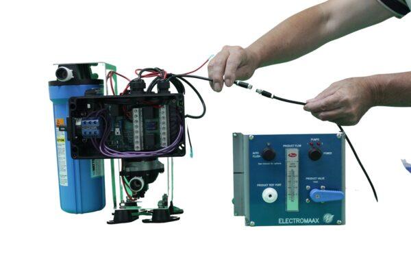 Man connecting Solarmaax watermaker kit to control panel