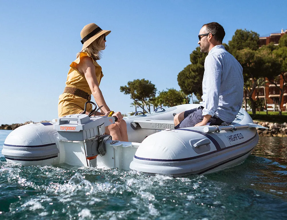 boaters in zodiac using Torqeedo electric outboard